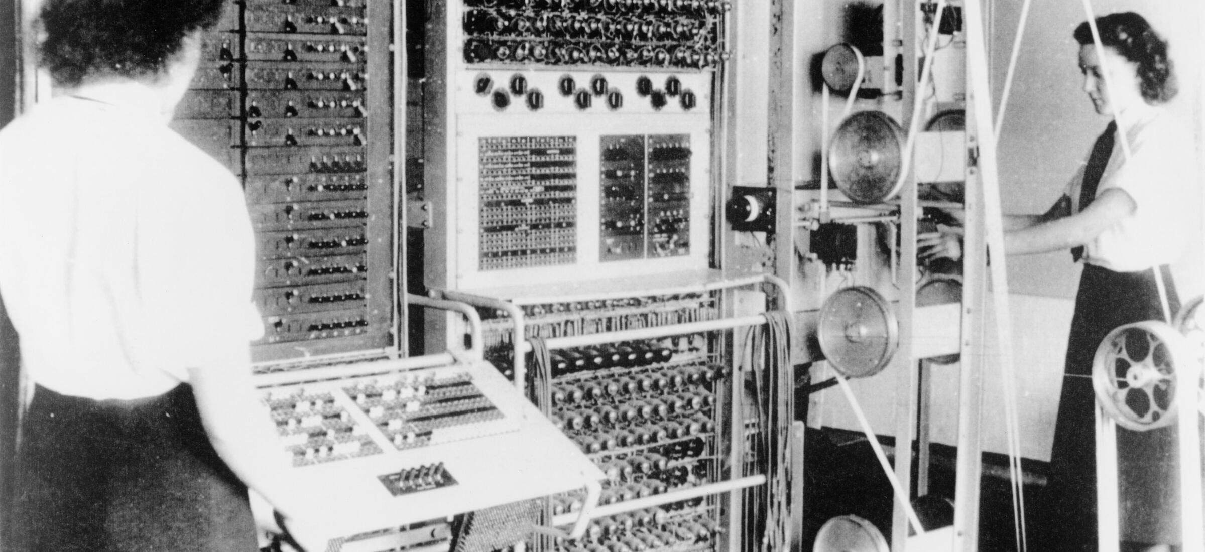 Operators Dorothy Du Boisson and Elsie Booker at a Colossus codebreaking computer, Bletchley Park